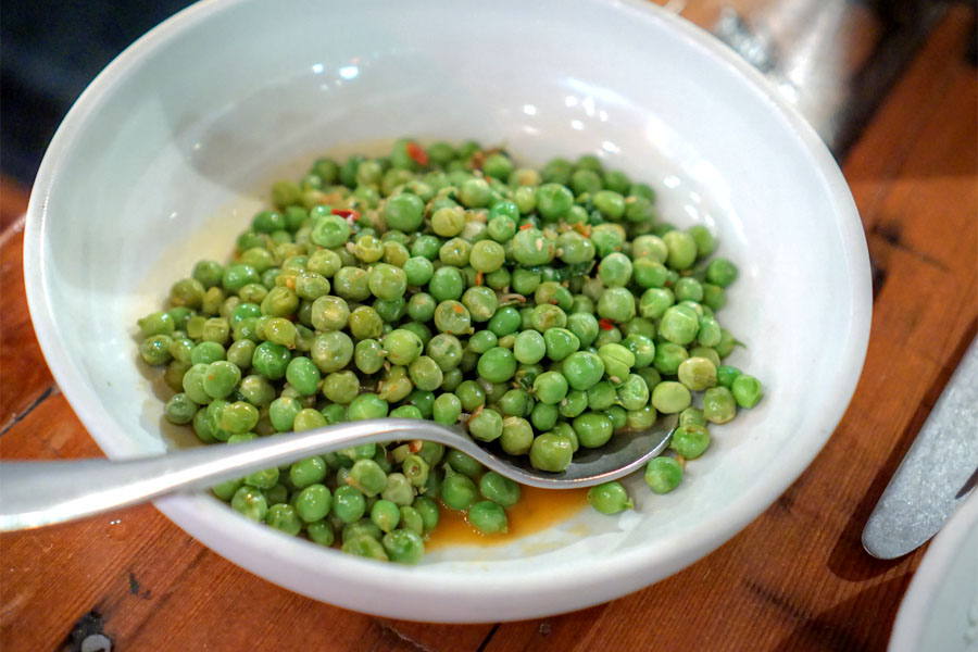 Sautéed english peas, green garlic, sesame