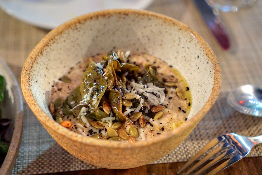 Hand-milled rye and rolled oat porridge with pecorino, pickled beet greens and urfa chile