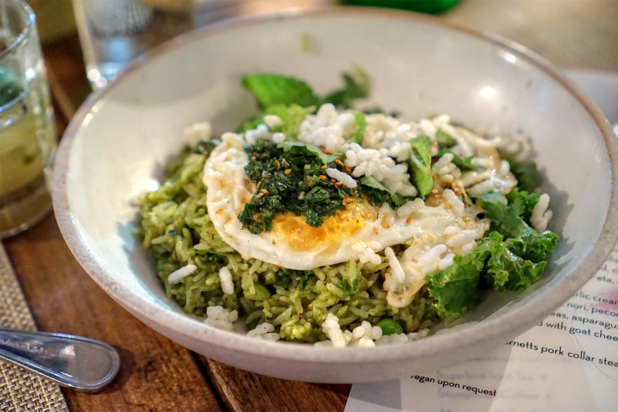 Green piri-piri rice with peas, asparagus, over-easy egg, crispy rice, lime zest and soft herbs