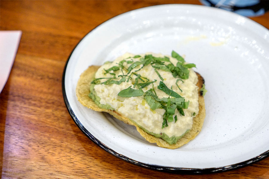 crab tostada, chili mayo, fresh herbs