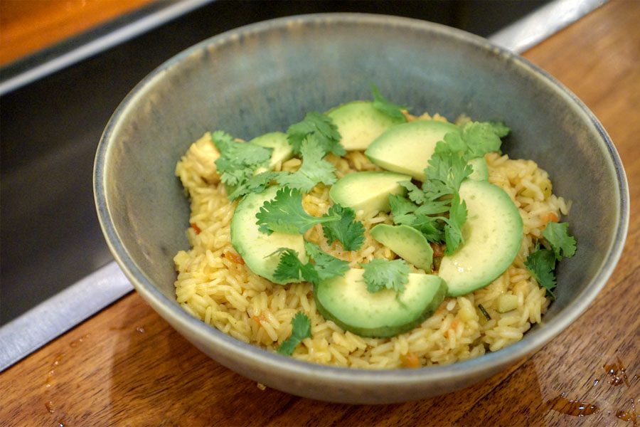 arroz con pollo, chorizo, saffron, avocado, cilantro