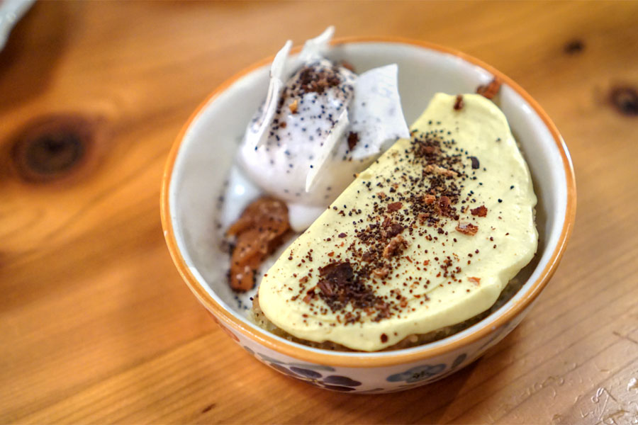 Semolina cake, turmeric whipped cream, poppy seed & coconut sorbet, whey meringue