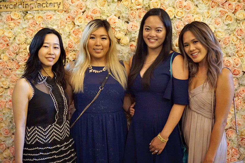 Four Girls in Front of Flower Wall