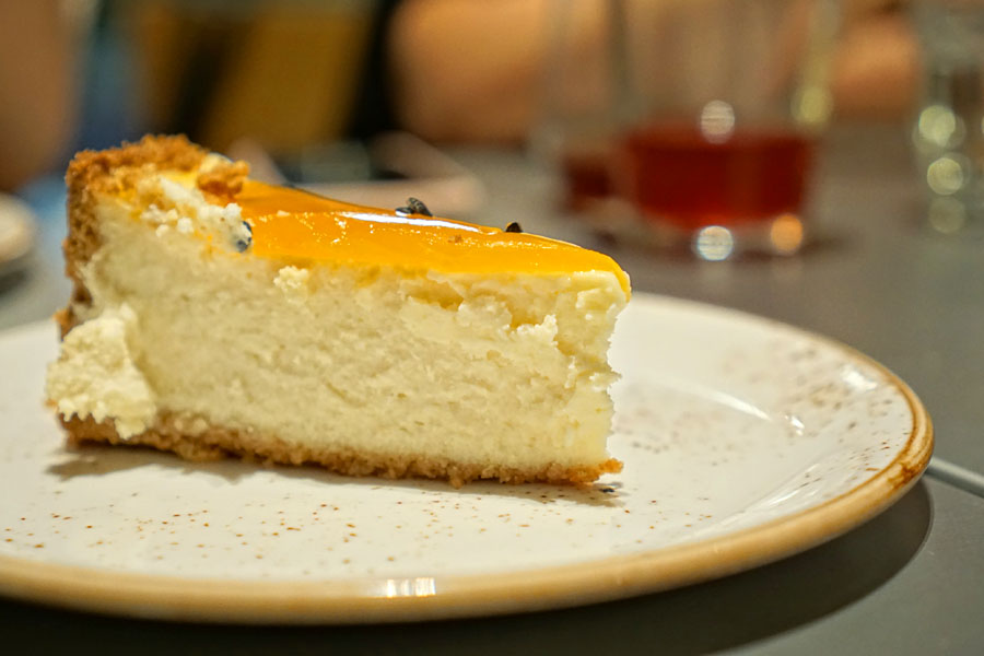 coconut cheesecake with passion fruit - sliced