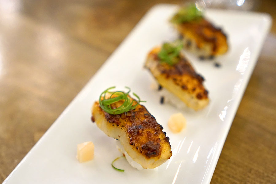 pork toro nigiri, doubanjiang, crispy rice, shiso, young ginger