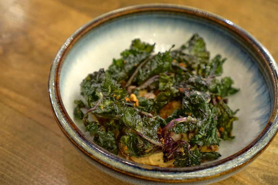 Baby octopus, hummus, lollipop kale, harissa, leeks, garlic