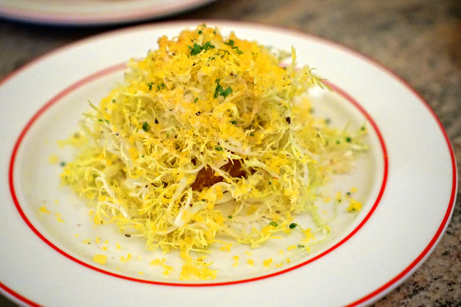 Frisée, crispy potato, egg yolk bonito