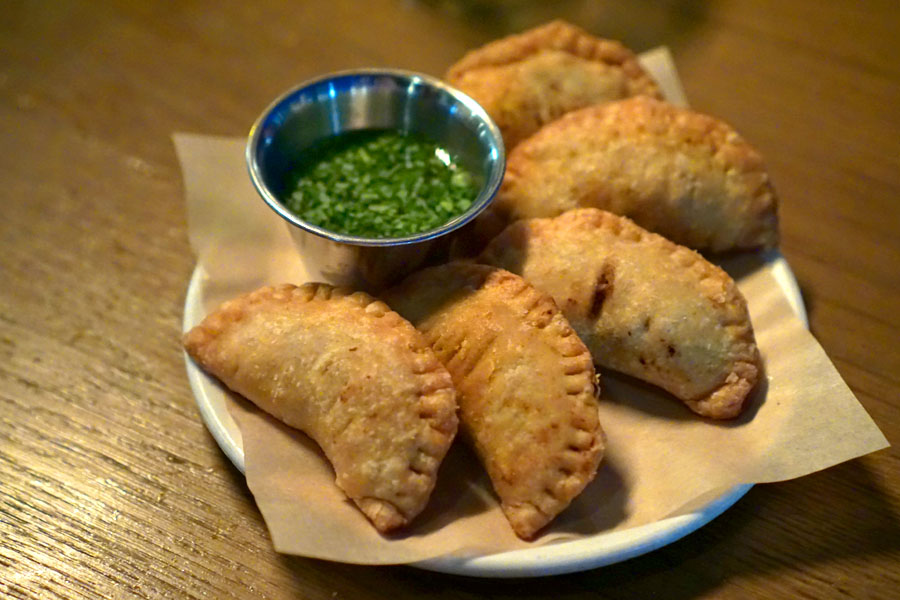 Empanadas, dry aged ground beef, green onion, smoked paprika, brazilian hot vinegar