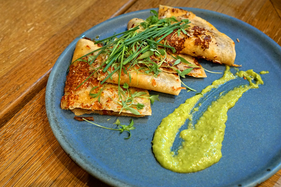 Lamb barbacoa quesadilla, heirloom sonoran flour, cotija crust, guacasalsa