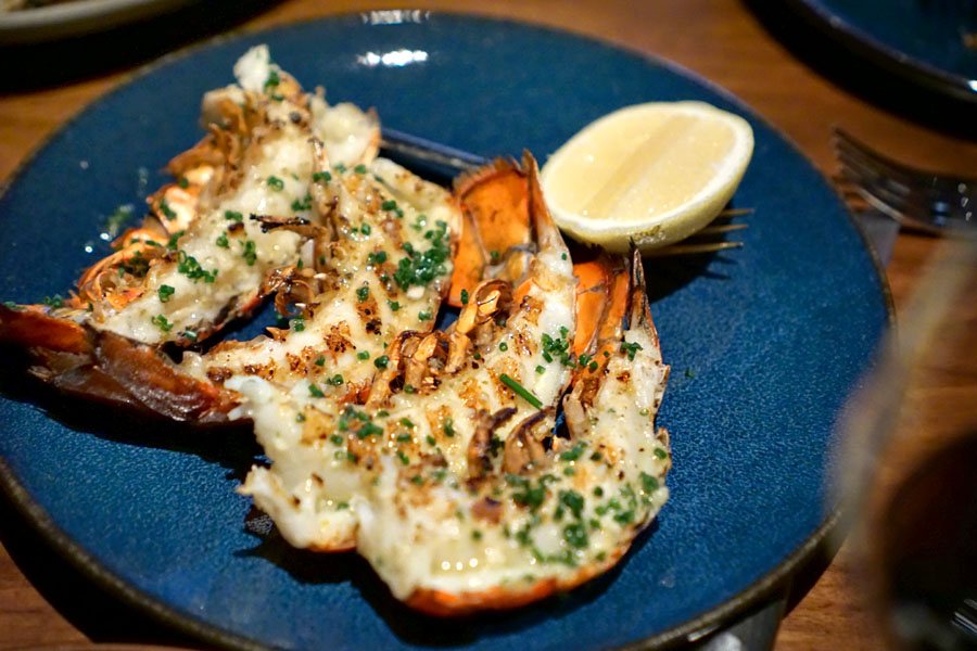 Lobster Tails cooked over the wood fire with yuzu-kosho garlic butter