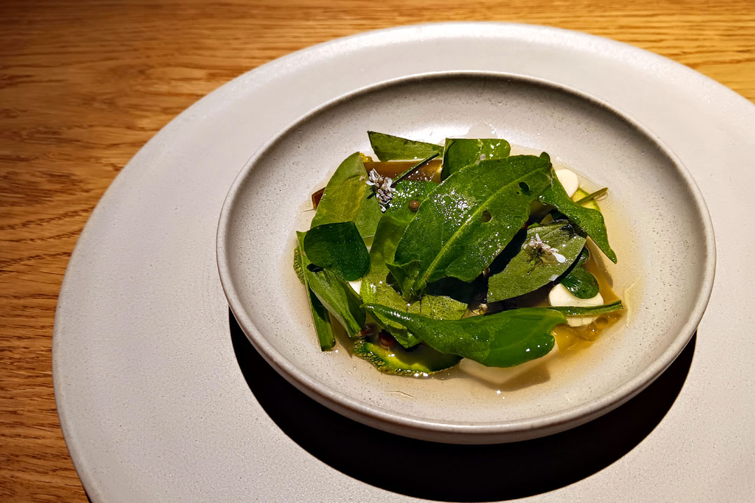 Summer vegetables in a fermented pea broth