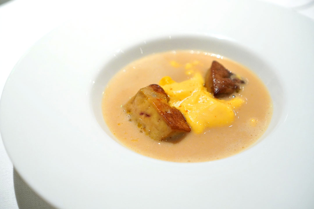 Game bird velouté soup with sweet corn and pan fried diced foie gras