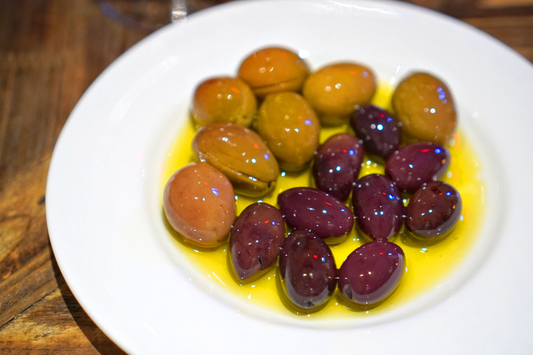 warm olives in grilled olive leaf oil