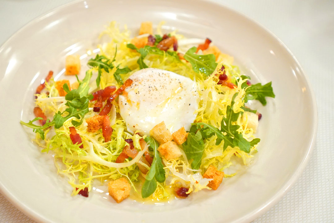 Salade frisée aux lardons; with mustard vinaigrette, croûtons, and farm egg