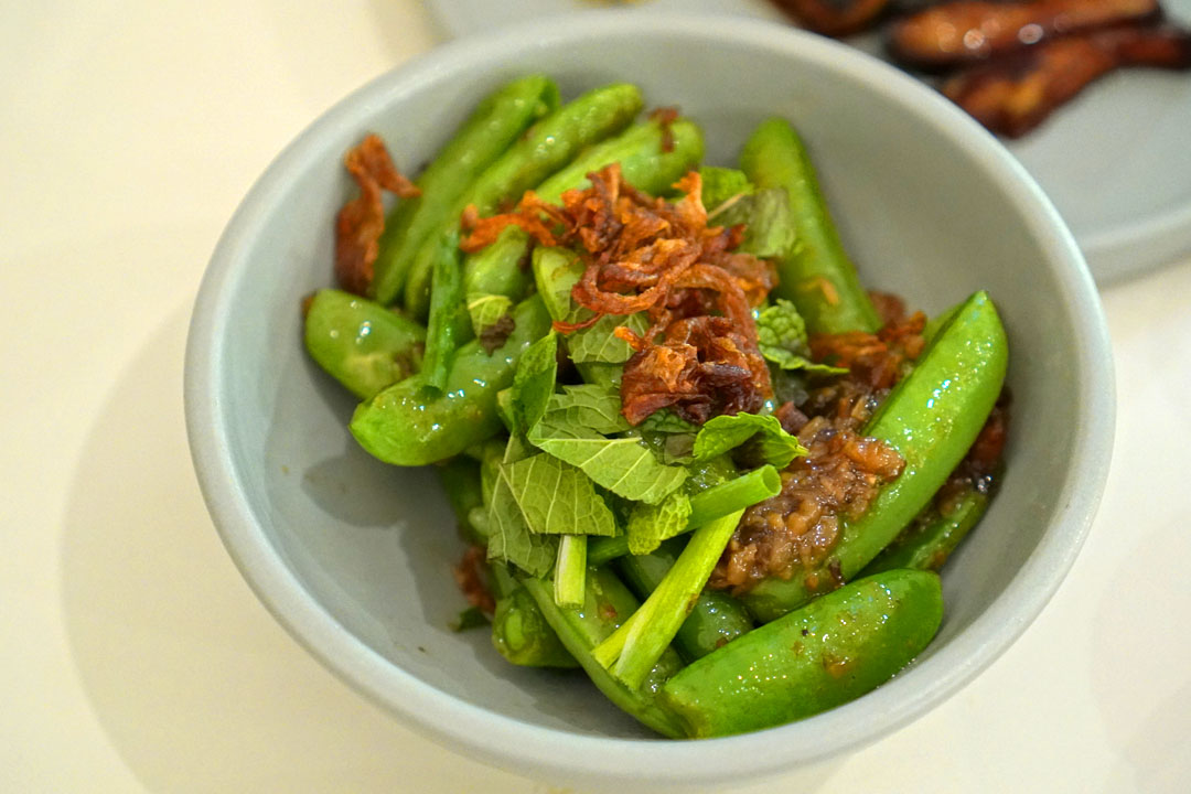 Blistered Sugar Snap Peas, mushroom meat, fried shallots, mint, chives