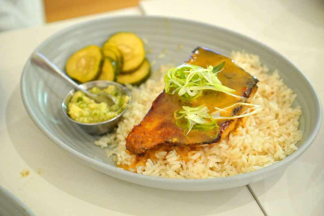 'Hainan' Fish Rice, dry-aged barramundi, chicken fat rice, chili butter, ginger scallion sauce, pickled cucumbers