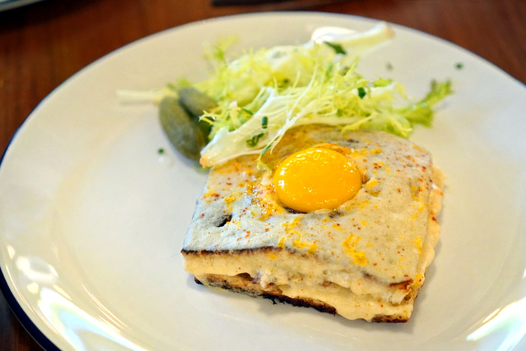 Croque Madame of ham katsu, gruyère, mornay sauce, Estevan's shokupan, frisée