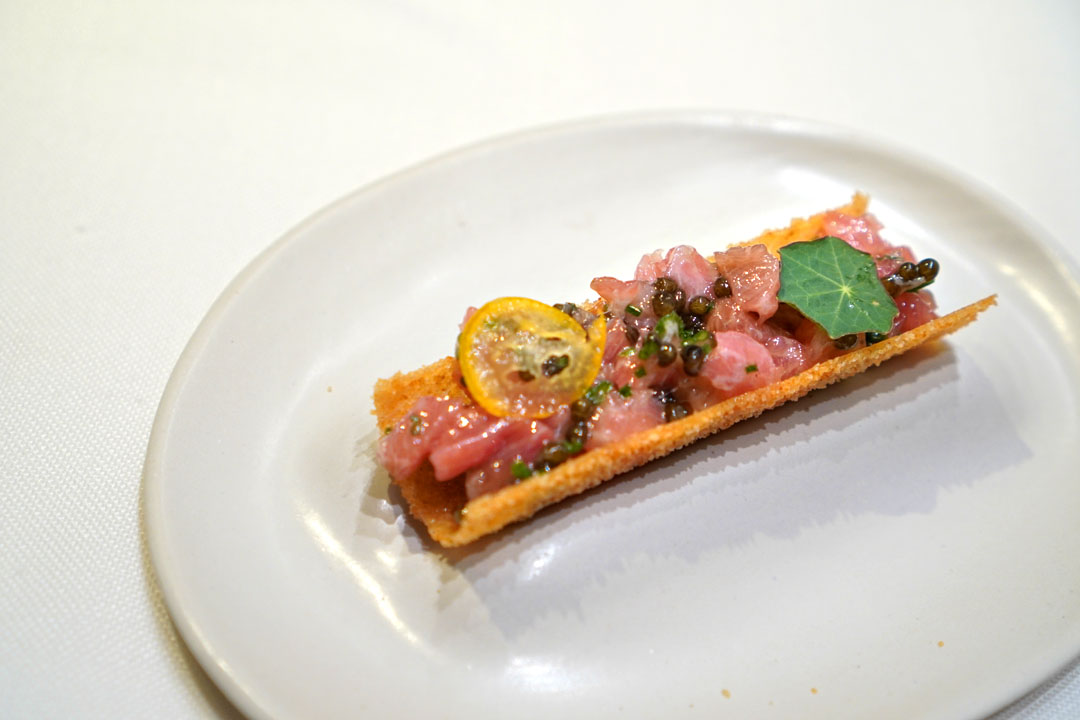 Twirl of crouton sticks with creamy salad, caviar and cured tuna